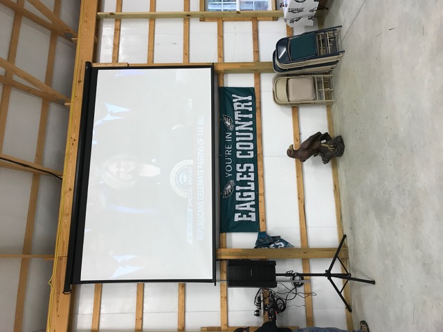 Projector screen setup in garage man cave in NJ